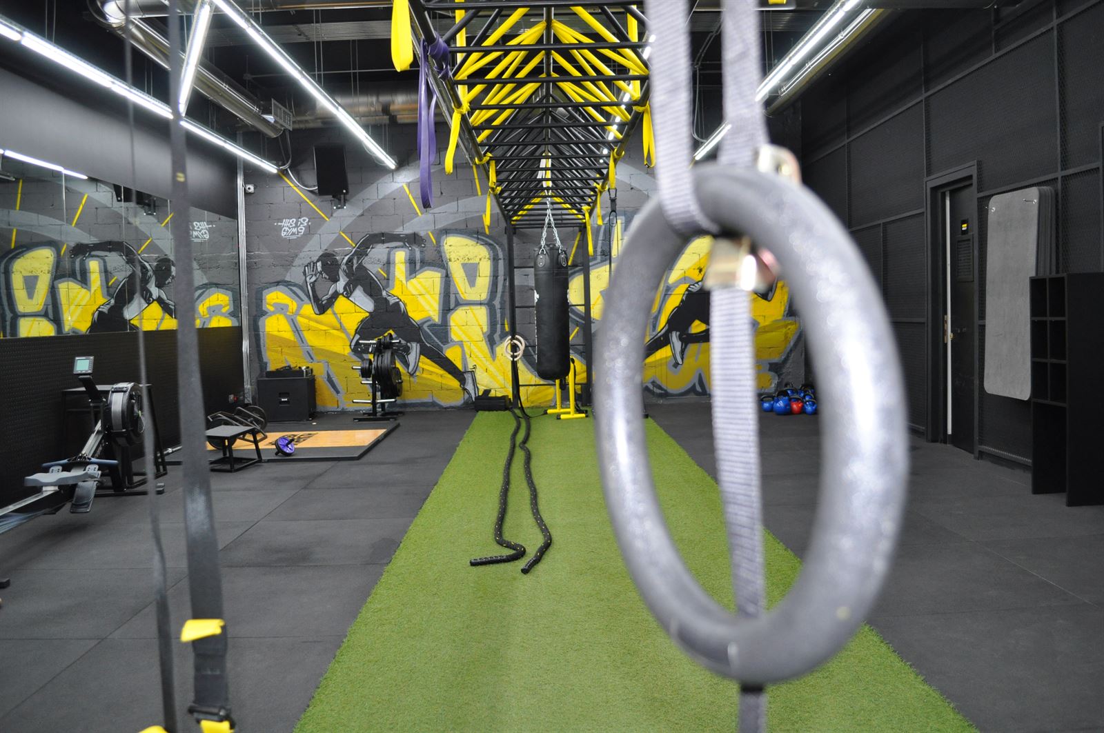 Gymnastic rings and turf training area